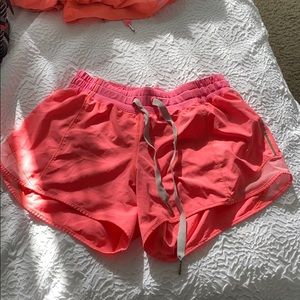 Size 4 pink lululemon running shorts